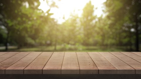 Wood Table and Chair, Wood table bar and nature tree bokeh blurred background at morning time and beautiful nature sun light, Top wood table space area for products shows. 4K UHD. Video Clip.