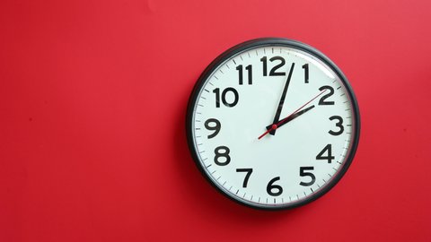 Time-lapse of a Clock on Red Background