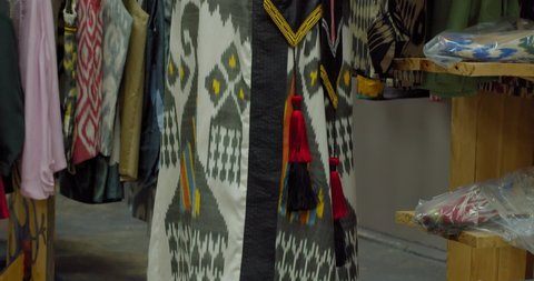 Adras ikat dress in the shop. Silk road Uzbekistan Central Asia.