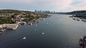 Lake Union Boating Drone Video with Skyscraper Buildings in Seattle City Skyline Background