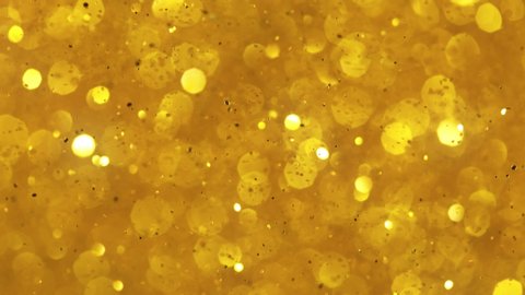 Super Slow Motion Shot of Golden Glitter Background at 1000fps. 스톡 비디오