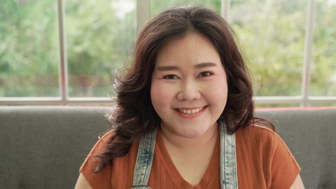 Portraits, cute smiles and charming Asian fat women.