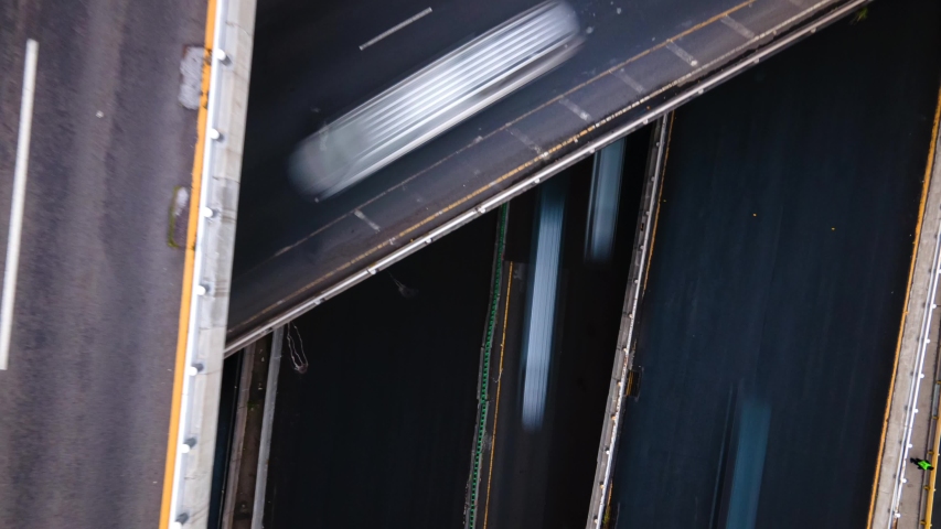 Aerial pedestal rising hyperlapse of highway in Mexico City at night