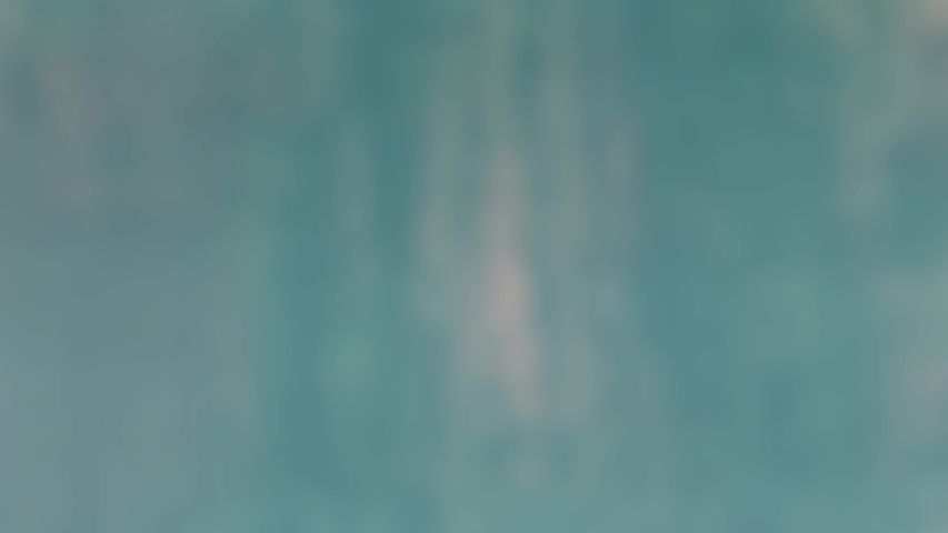 Blurred out of focus water reflection in pool of water