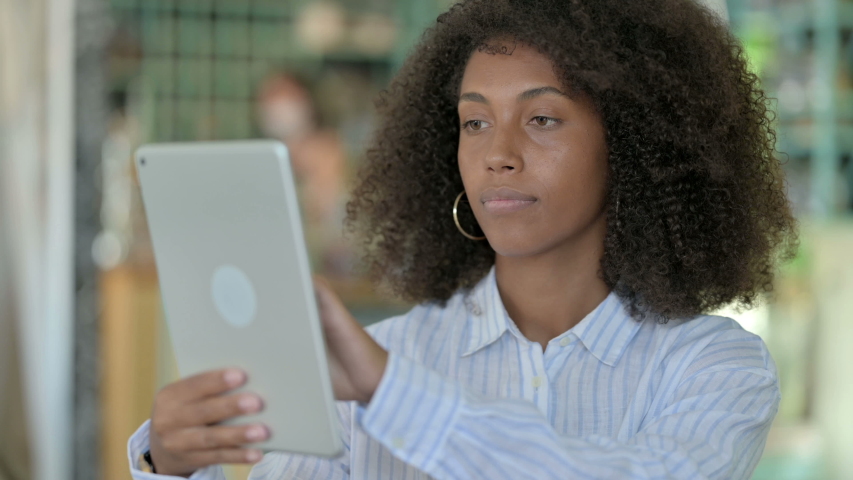 Portrait of African Businesswoman using Digital Tablet | Shutterstock HD Video #1058212393