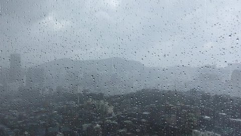The raining window. Scenery of Seoul downtown seen through it. 
