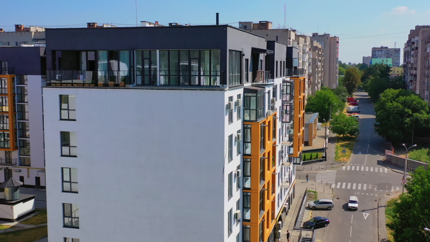 Contemporary residential building in the city. Exterior of a modern design of multistorey apartment building. Aerial view.