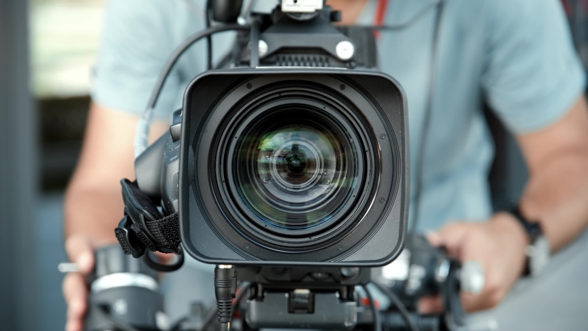 Close up view on a working video camera lens with inner rings seen inside. | Shutterstock HD Video #1058221903