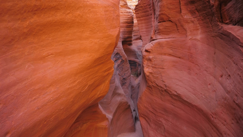Camera movement on slot canyon with curved and smooth sandstone vertical walls of red orange color, amazing rock formations antelope canyon, beautiful place to hiking. In Arizona, Utah Usa.