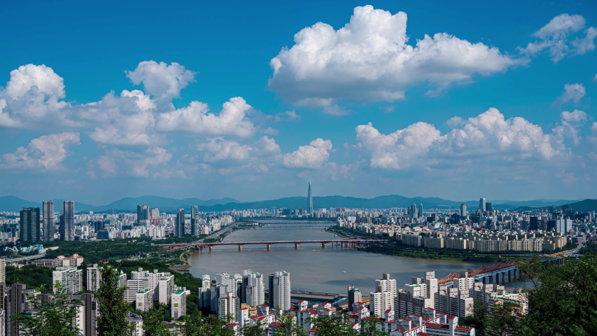 Landscape of Seoul City, modern building and han river with traffic on bridge seen from maebong mountain .at summer in south korea Royalty-Free Stock Footage #1058222665