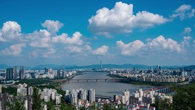 Landscape of Seoul City, modern building and han river with traffic on bridge seen from maebong mountain .at summer in south korea