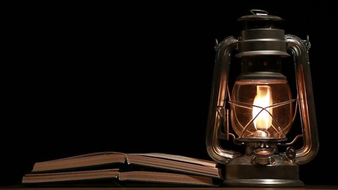 footage of book lamp dark background 