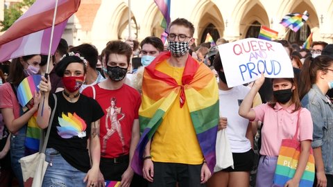 KRAKOW, POLAND - AUGUST 29, 2020: Participants of the Krakow Equality March (Pride parade) on Main Market Square. Wearing masks against COVID-19 Coronavirus.