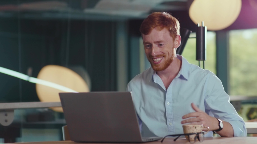 Surprised ginger businessman sitting in cafe receiving job approvement email removing facial mask celebrating day of employment. Business triumph. Victory. Happiness. | Shutterstock HD Video #1058231992