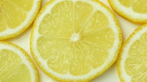 Rotation of a juicy yellow lemon. Top view, 360 degree rotation, close-up of a lemon in a cut.

