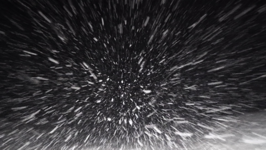 A Car Driving Down the Highway Through Snow and Blizzard Looking Through the Windshield Falling Snow Night Road Snowflakes Winter Storm | Shutterstock HD Video #1058247163