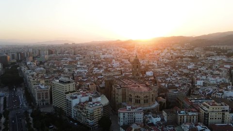 Málaga, Andalucia, Spain - drone shot of the cityscape while sunset.