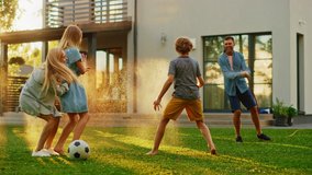 Happy Family of Four Playing with Garden Water Hose, Spraying Each Other. Mother, Father, Daughter and Son Have Fun Playing Games in the Backyard Lawn of Idyllic Suburban House on Sunny Summer Day - Powered by Shutterstock - Get 15% off with code: PIKWIZARD15