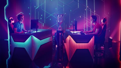 Two Professional Esport Gamers Competition in a Video Game on a Championship Arena, Both Celebrate Winning and Get Upset During Lost Rounds. Cyber Gaming Tournament Live Streaming Event. Arc Shot
