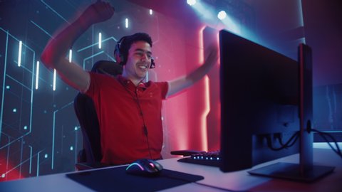 Professional eSports Gamer Playing in Computer Video Games, Happily and Cheerfully Celebrates Victory and Success. Online Cyber Championship / Tournament. Portrait Side View, Slow Motion Camera Shot
