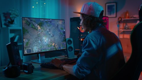 Professional eSports Gamer Plays RPG MOBA Mockup Video Game with Modern Graphics ad Fun Gameplay on a Powerful Personal Computer. Cyber Gaming Stylish Retro Neon Room
