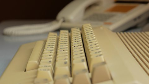 Typing on old computer (close up)