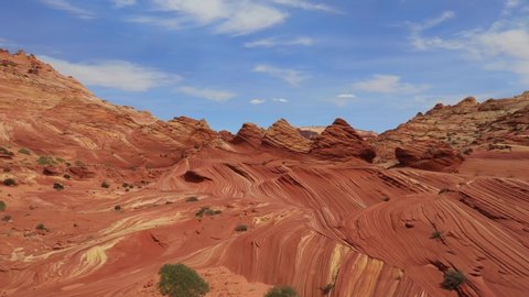 Drone Flight Through a Wild Desert Landscape Coyote Buttes / Vermillion Cliffs Wilderness Area with Strange Hoodoos and Navajo Sandstone