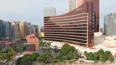 Macau , Macau / China - 08 12 2020: Rotating and rising aerial view of famous Wynn Casino Hotel, Macau