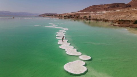 Drone footage of The Dead Sea, known in Hebrew as Yam Ha-Melakh (the Sea of Salt) is the lowest point on earth, surrounded by the stunning landscape of the Negev Desert