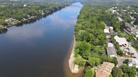Overhead aerial landscape view of Delaware river of Lambertville New Jersey, near small town historic New Hope Pennsylvania USA