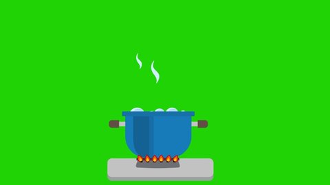 A pot with boiling water inside. Prepare soup on low heat. Cook a meal. The fumes of boiling water rose in the pot, then the pot was turned off. green background.