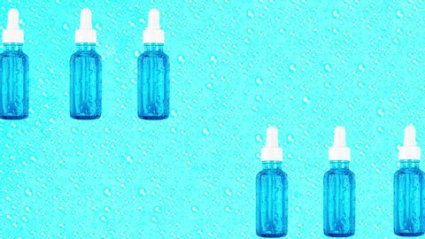 Essence moisturizing serum in glass bottles are moving on blue background with water drops. Hyaluronic acid for hydration. Trendy cosmetics concept. Products for makeup and skin care.  