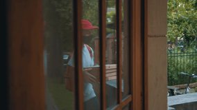 Pizza delivery man leaves the order on stairs for customer. Blonde young woman taking pizza boxes to the house. Social distancing. Pandemic. Health care issues. - Powered by Shutterstock - Get 15% off with code: PIKWIZARD15