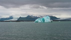 Floating iceberg in Jokulsarlon Glacier Gagoon, Iceland. Jokulsarlon is a glacial lake in southeast Iceland near Vatnajokull National Park. 4K UHD video.