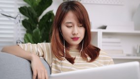 Beautiful Young Asian businesswoman in casual clothes
making video call conference talking, discussing with team or colleagues, online meeting communicating by laptop webcam. remote working concept.