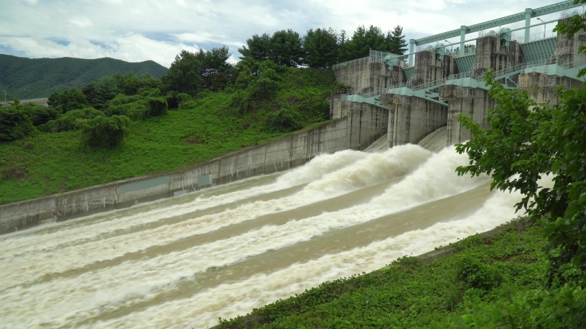 Spillway of dam in South Korea releasing water overflow from reservoir, static