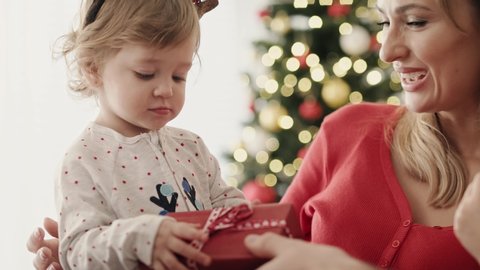 Video of little girl with Christmas present on Christmas morning.  Shot with RED helium camera in 8K.