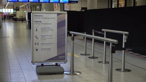SCHIPHOL, NETHERLANDS – AUGUST 2020: Sign for Covid-19 testing center at Schiphol airport in the Netherlands, passengers can be voluntarily tested for coronavirus