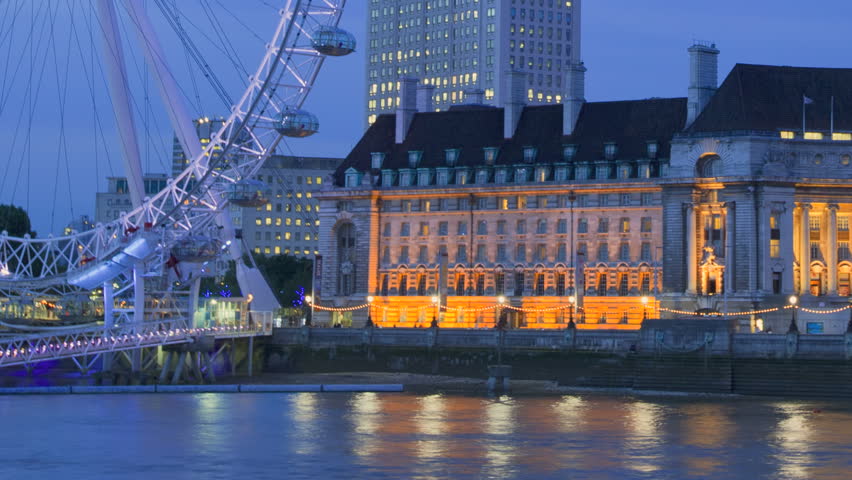 LONDON, ENGLAND - JUNE 29:Time-lapse view of London Eye at night on June 29,
