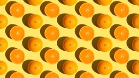 Stop motion Cut and whole tangerines alternate from left to right over orange background