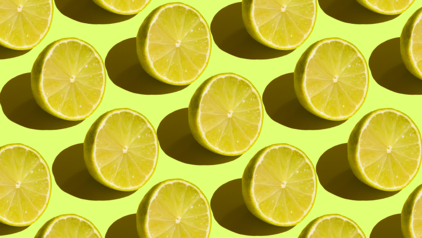 Stop motion Cut and whole green limes alternate diagonally on a green background | Shutterstock HD Video #1058321029