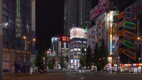 tokyo, japan - august 27 2020: Pan video of the scramble of the electric district of Akiba with the iconic SEGA Akihabara 2nd building closed in August 2020 due to the crisis of corona virus pandemic
