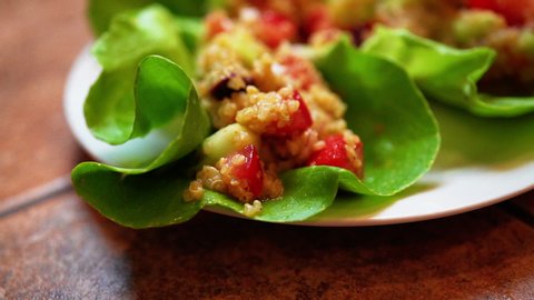 Macro view of lettuce wraps or cups on a plate and ready to serve - focus pull