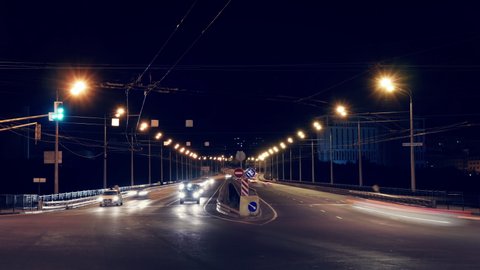 Night city street timelapse with view on road lights and car traffic. Seamless Ultra HD 4K loop footage of City Life.