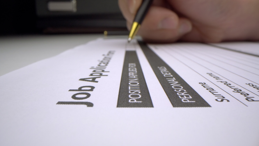 Motorized moving shot of completing job application form, shot with macro probe lens Royalty-Free Stock Footage #1058352175