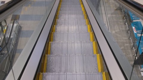 empty escalator staircase moving down