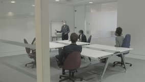 Business people meeting in boardroom wearing protective face mask for presentation - Powered by Shutterstock - Get 15% off with code: PIKWIZARD15