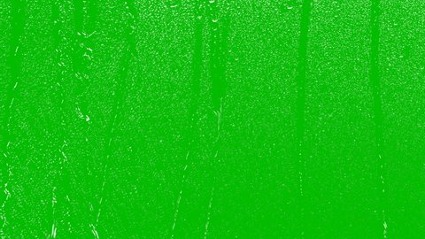 Close-Up. Realistic rain and water droplets with chroma key green screen background. Animation