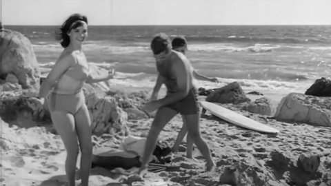CIRCA 1965 - In this classic teen movie, teenagers swim, surf and dance at the beach.