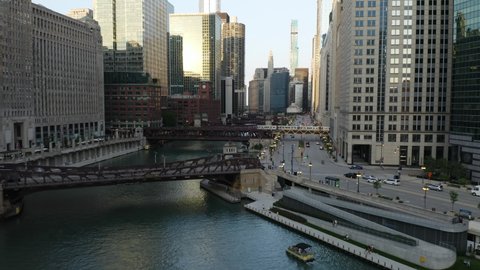 CTA Train Crossing Chicago River as Drone Flies over Bridge, Low Angle